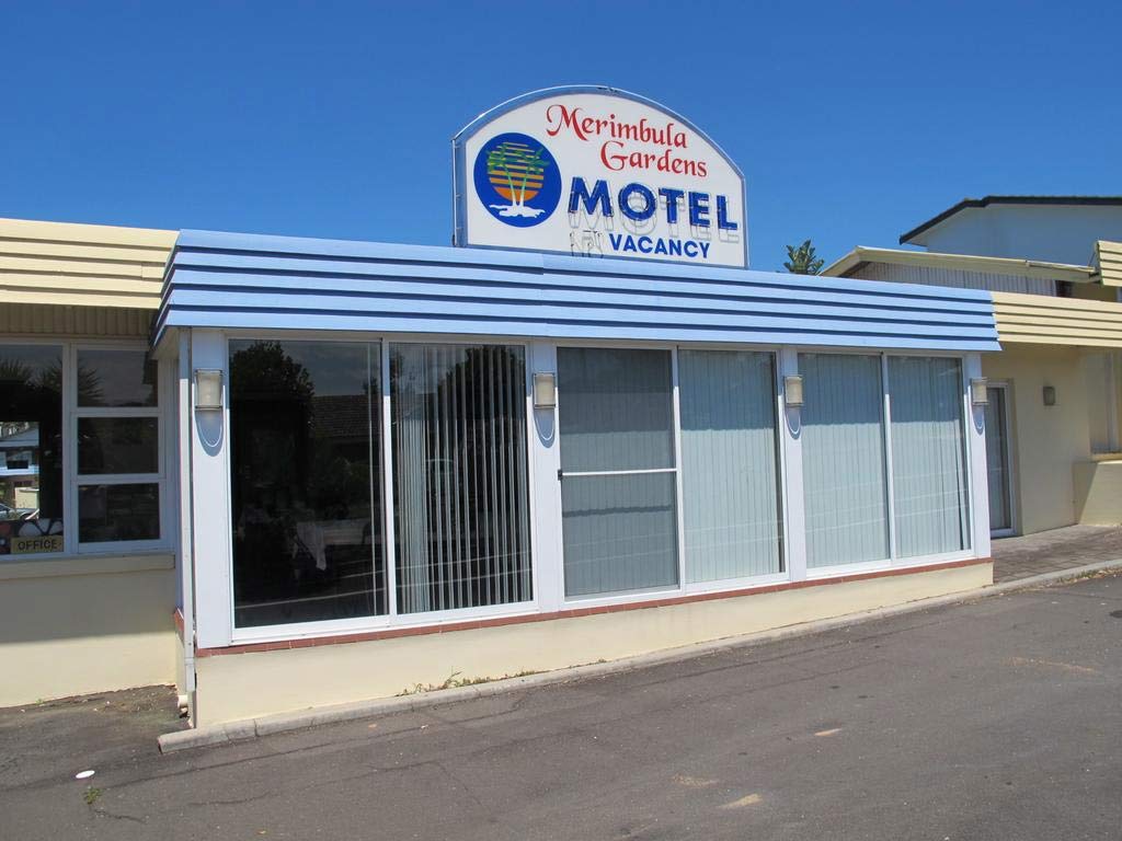 Motel exterior / garden — wide warm photo